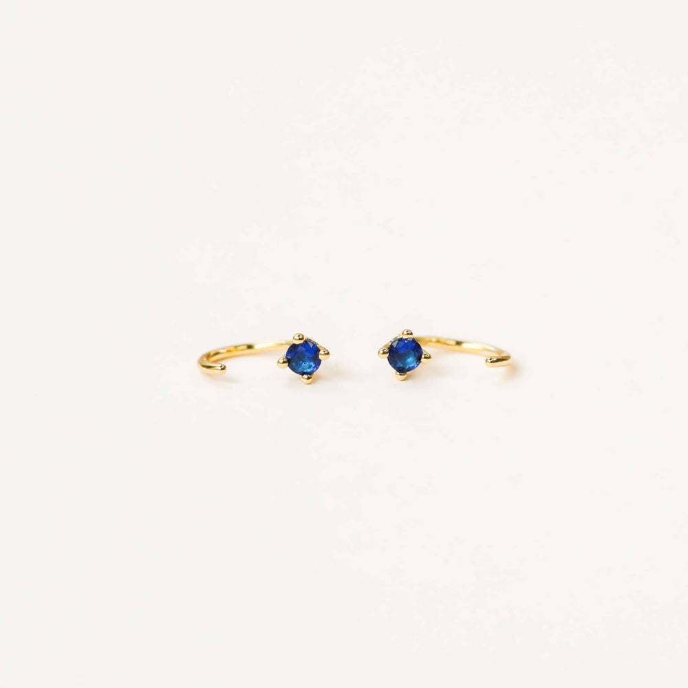
                      
                        CZ Huggies - Sapphire - Gold Earrings
                      
                    