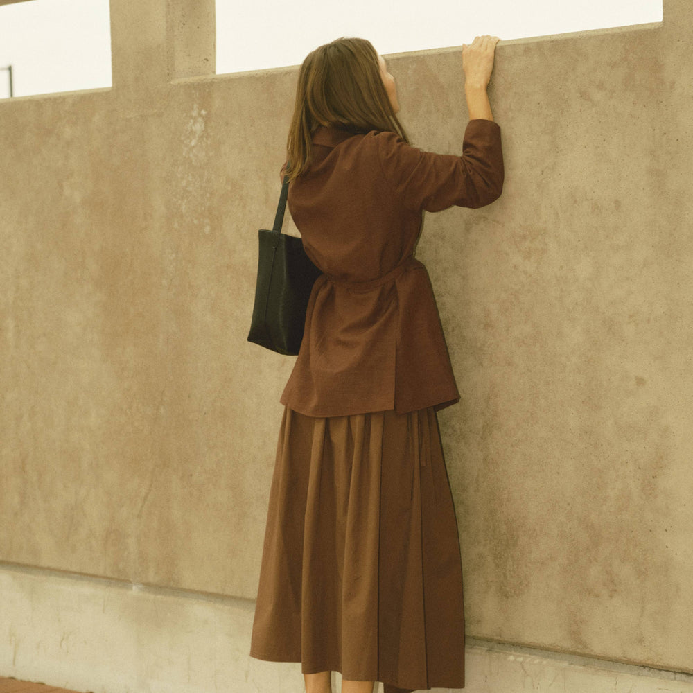
                      
                        The Kiana Midi Skirt with Side Waist Ties
                      
                    