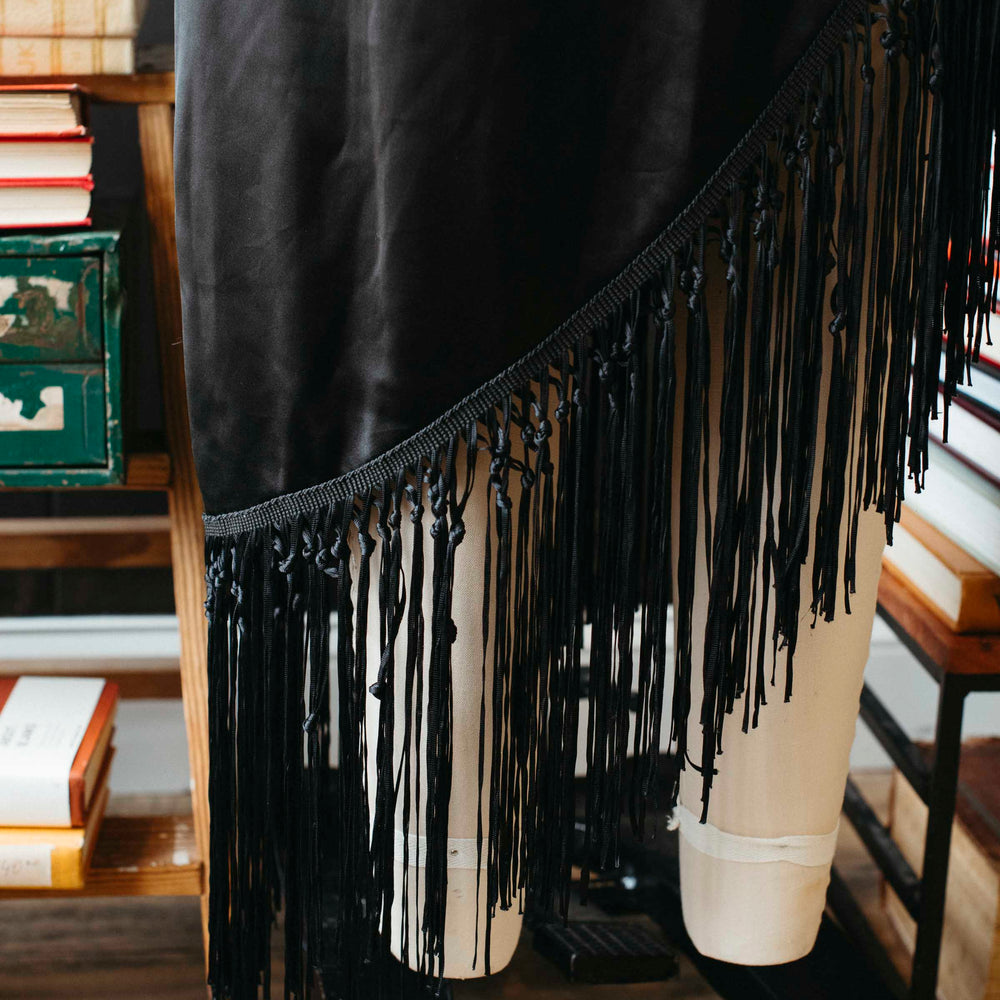 
                      
                        Pre-loved Black Asymmetrical Fringe Skirt - Size M
                      
                    
