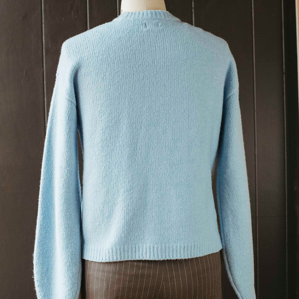 
                      
                        Pre-loved Powder Blue Bow Sweater - Size M
                      
                    