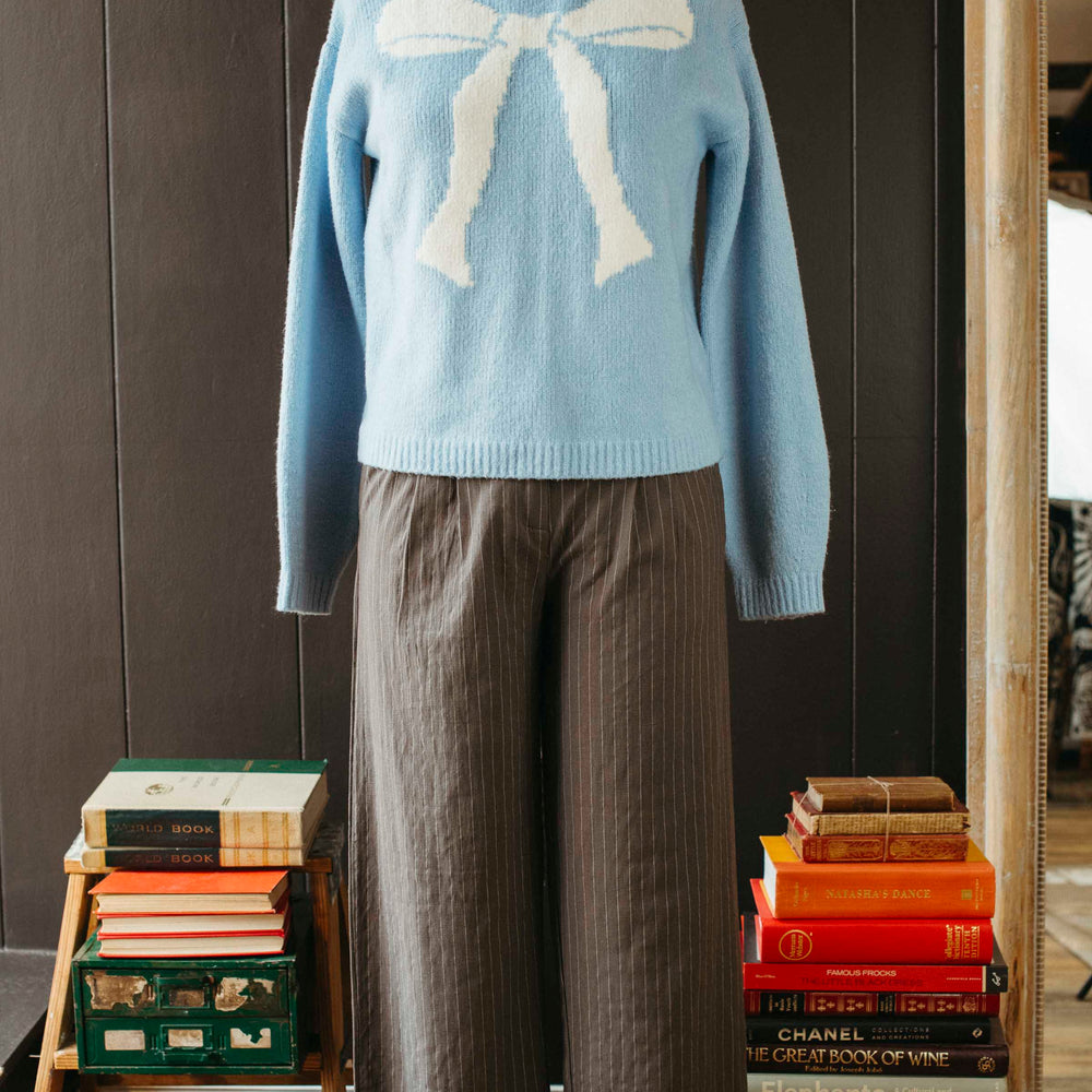 
                      
                        Pre-loved Powder Blue Bow Sweater - Size M
                      
                    