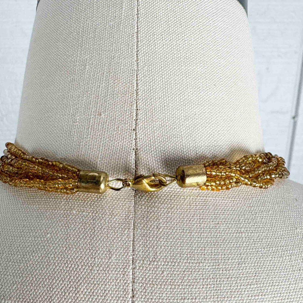 
                      
                        Vintage Gold Painted Lucite Necklace
                      
                    