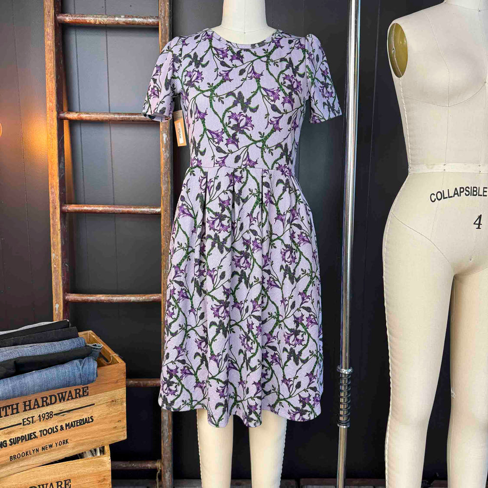 
                      
                        Pre-loved Lavender Floral Midi Dress - Size L
                      
                    