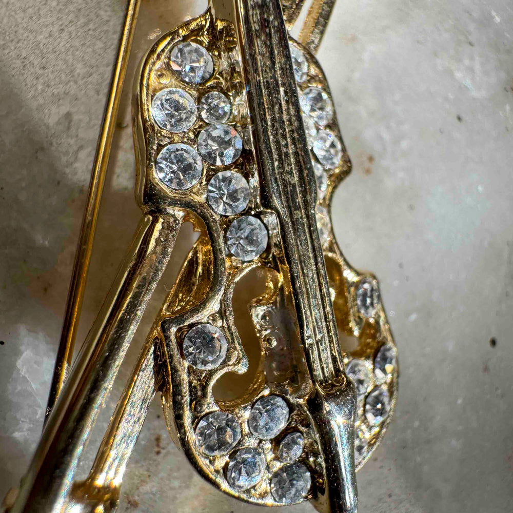 
                      
                        Vintage Rhinestone Violin Brooch – Gold Tone Music Lover Pin
                      
                    