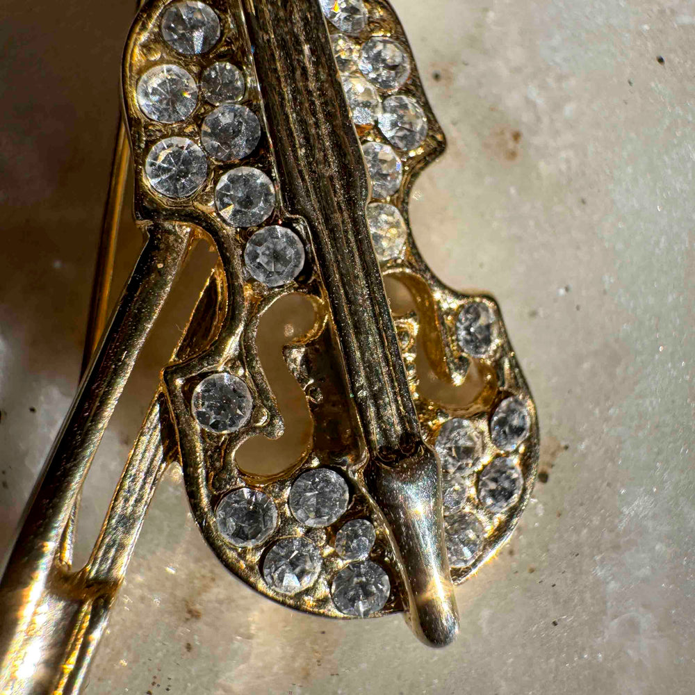 
                      
                        Vintage Rhinestone Violin Brooch – Gold Tone Music Lover Pin
                      
                    