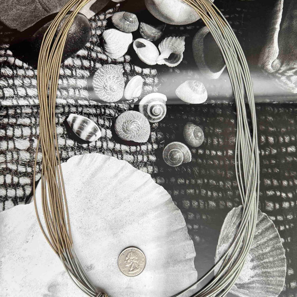 
                      
                        Pre-Loved Recycled Piano Wire Necklace – Sustainable Chic
                      
                    