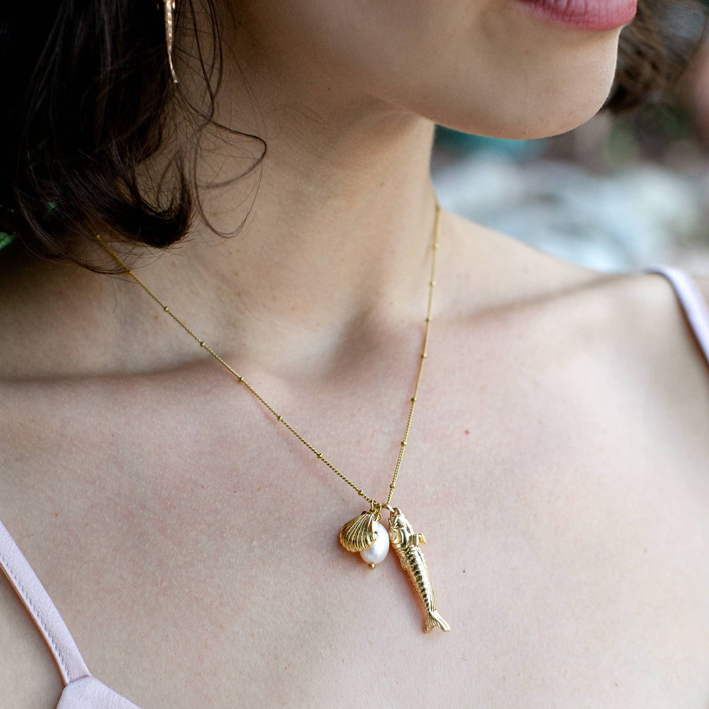 
                      
                        Pesce Pearl Necklace - 18K Gold Plated + Freshwater Pearl
                      
                    